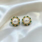 krivoya Devnavi pearl stud earrings featuring a central white pearl surrounded by small green beads in gold setting