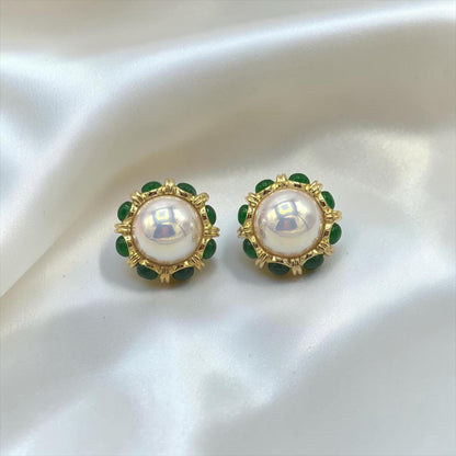 krivoya Devnavi pearl stud earrings featuring a central white pearl surrounded by small green beads in gold setting