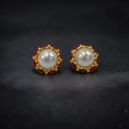 krivoya Devnavi pearl stud earrings featuring a central white pearl surrounded by small red beads in gold settings
