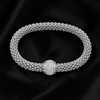 krivoya 92.5 pure silver beaded bracelet with a sparkling pavé set clasp on a black silk background