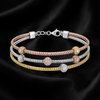 krivoya tri-tone sterling silver bracelet with textured bands and sparkling stone-studded accents on black silk